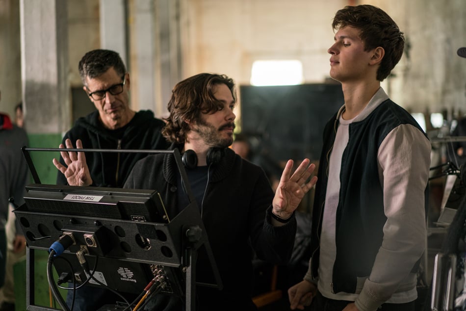 A behind the scenes shot of Ansel Elgort with crew