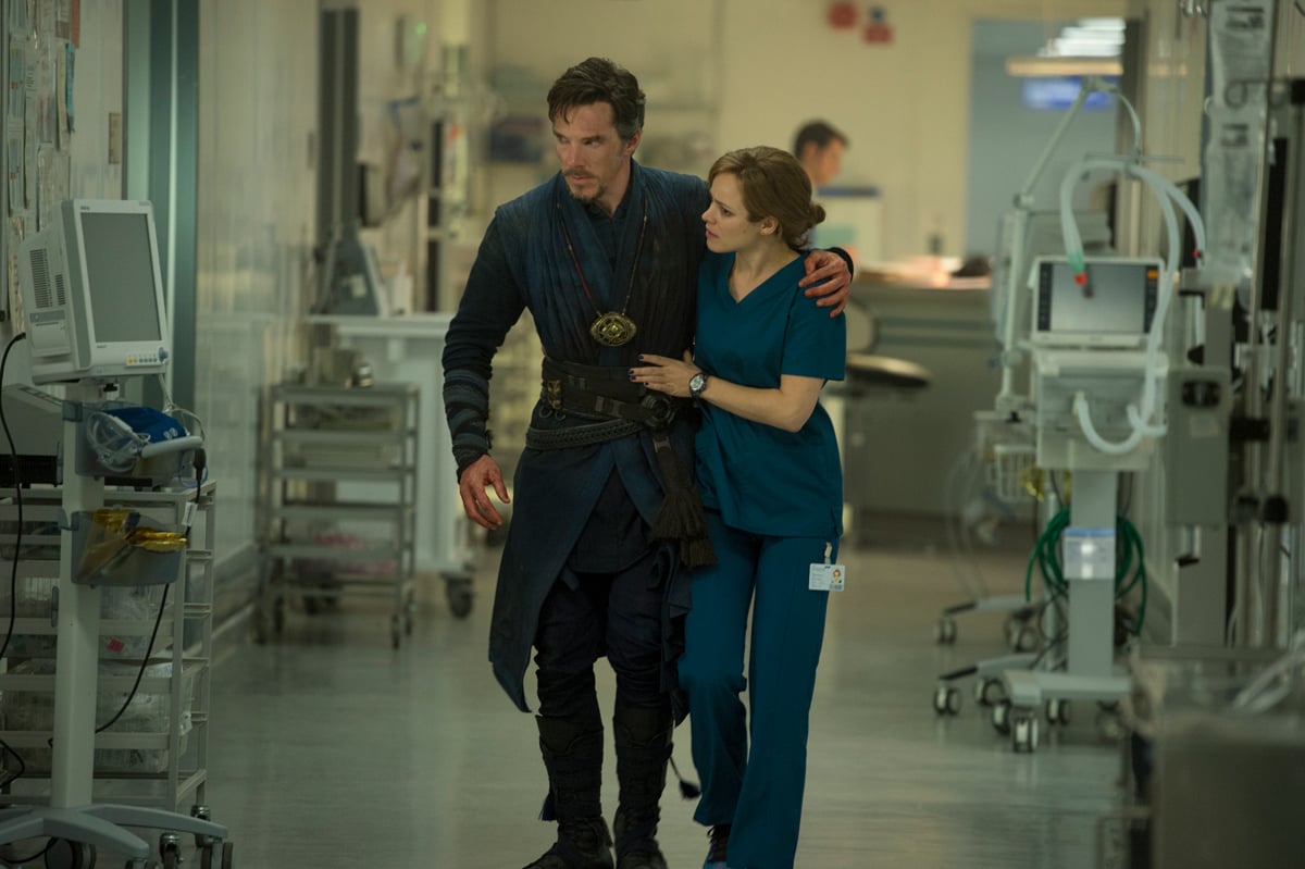 A still of Doctor strange being helped to walk through a hospital